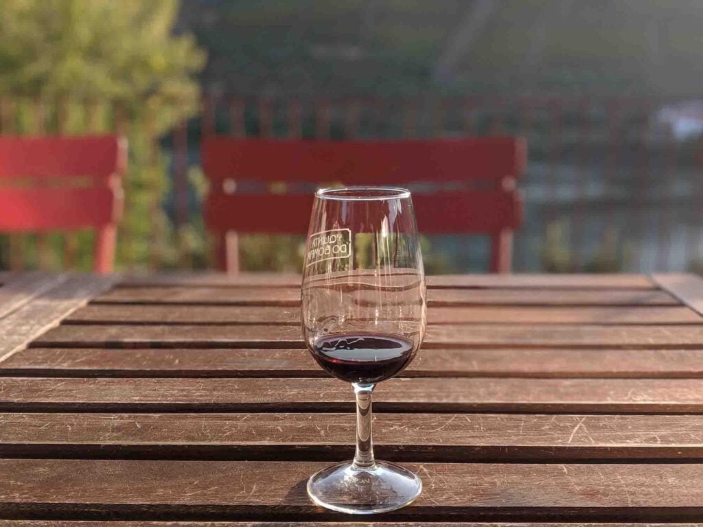 Port wine glass by the river