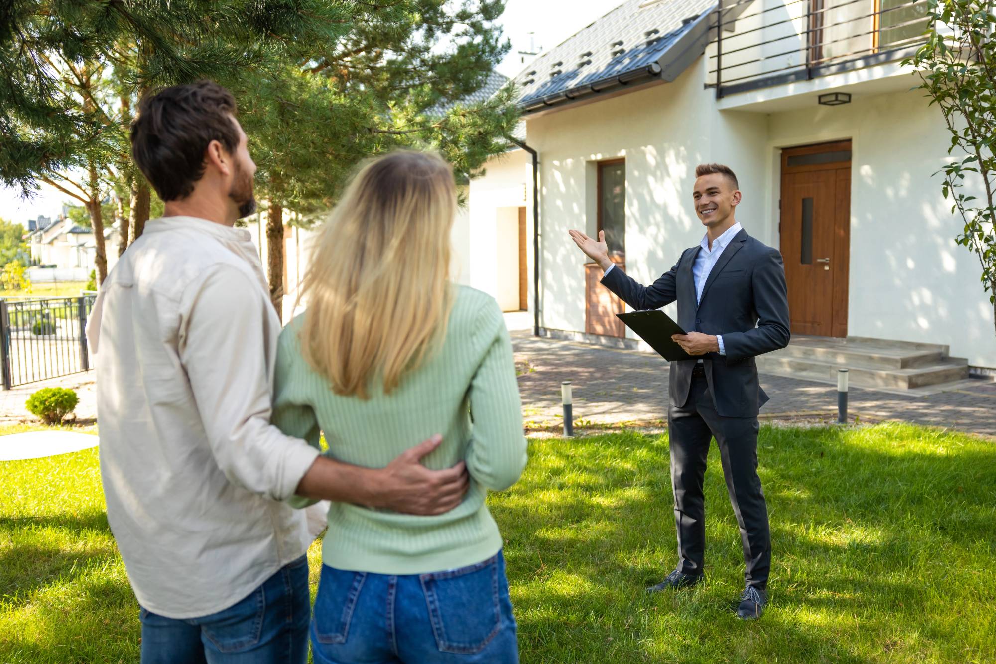 A buyer's agent meeting with a couple