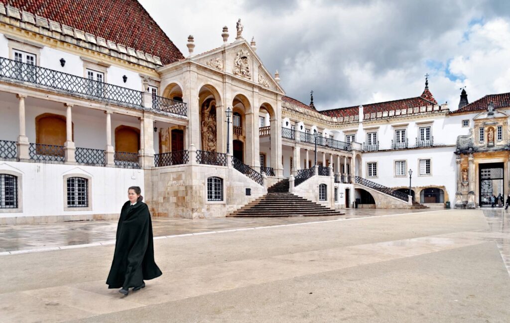 a female student walking through Coimbra university
