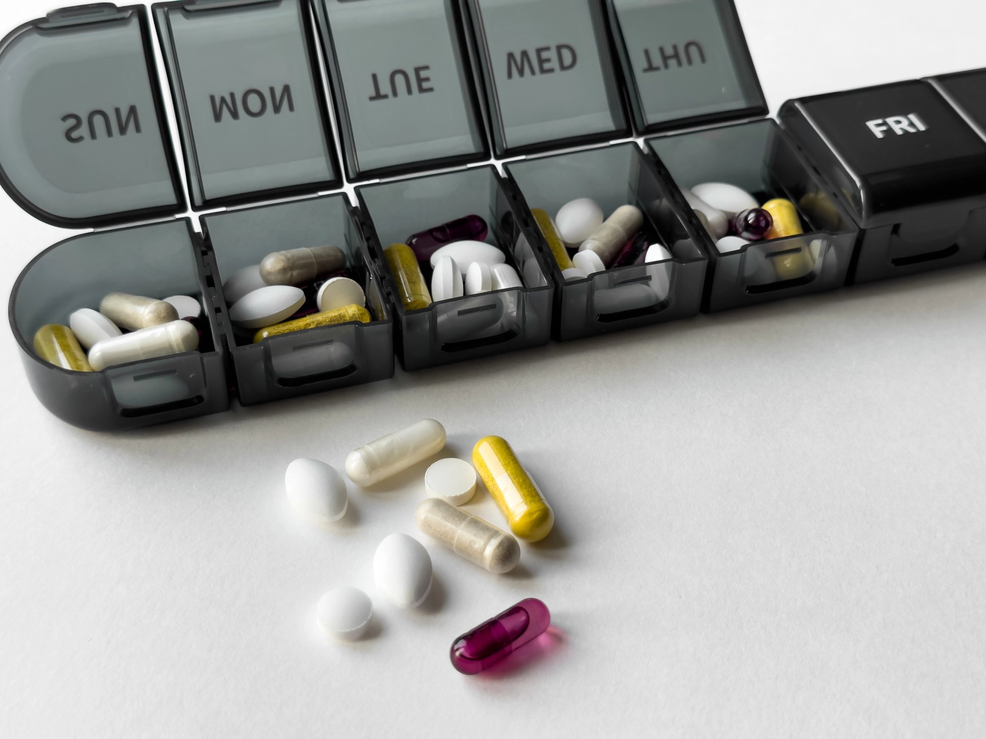 a box of medications with days of the week