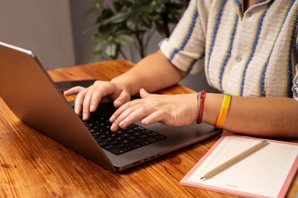 entrepreneur typing on a laptop