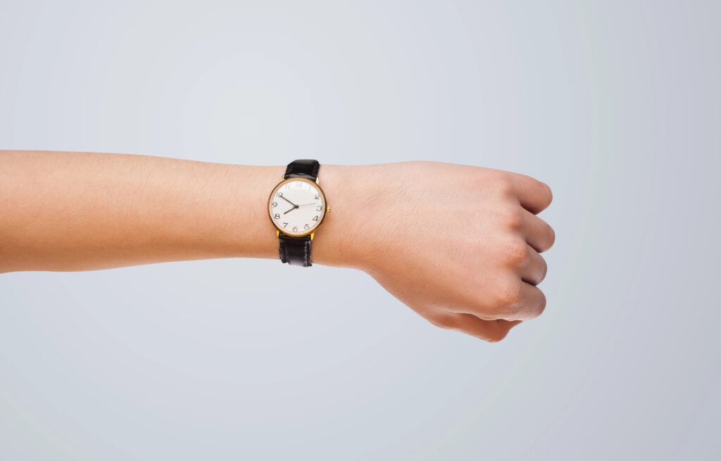 watch on wrist showing the time