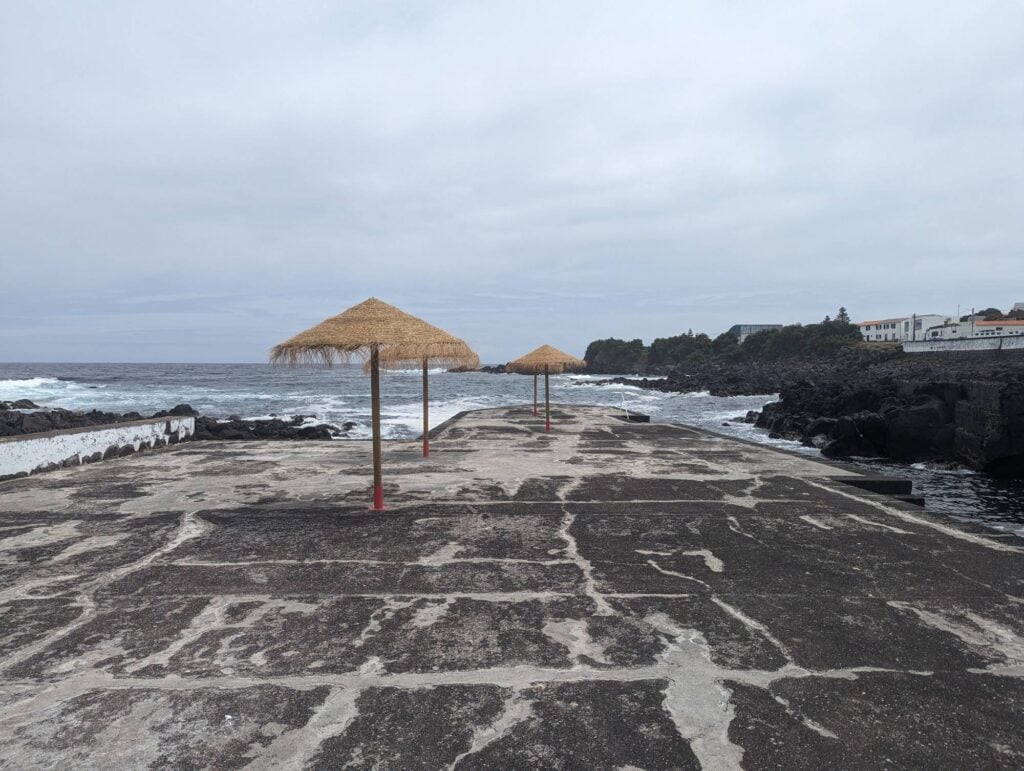 beach umbrellas at a rock beach in Graciosa